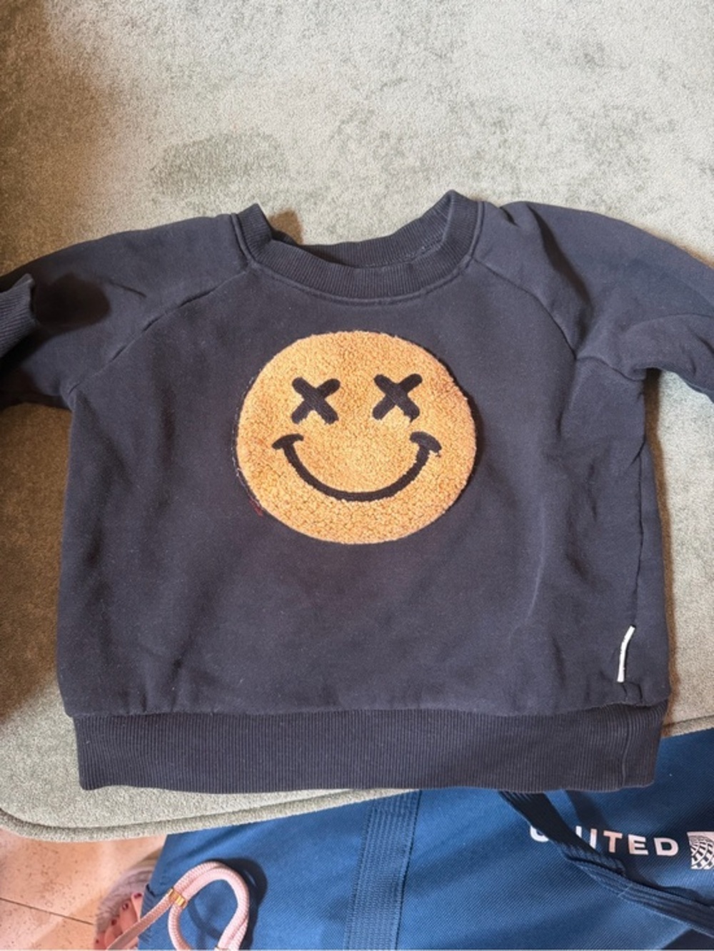 Huxbaby Black Sweatshirt with Orange Smiley Patch